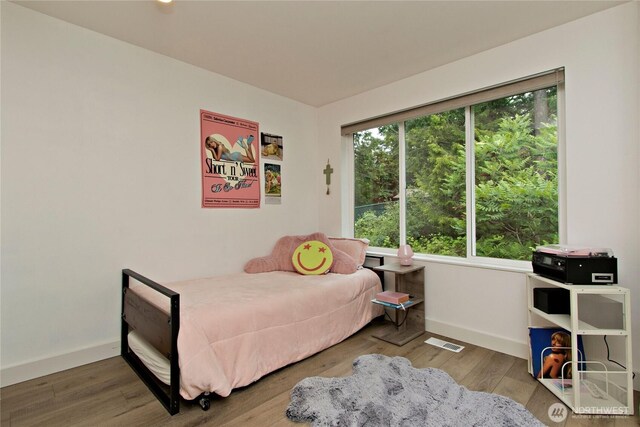 23300 SE Black Nugget Rd Unit J3, Issaquah, WA 98029 - bedroom featuring baseboards and wood finished floors
