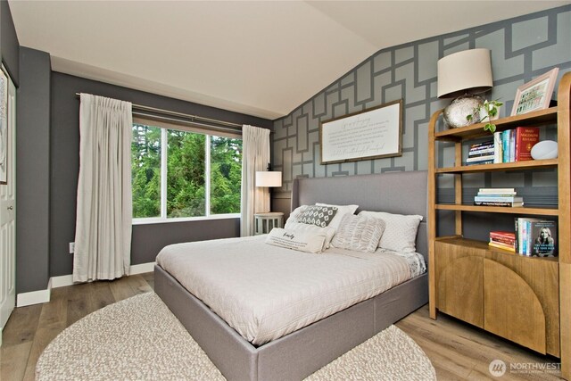 23300 SE Black Nugget Rd Unit J3, Issaquah, WA 98029 - bedroom featuring lofted ceiling and wood finished floors