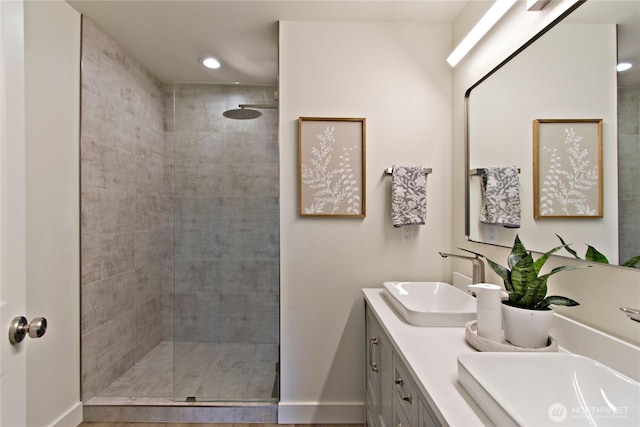23300 SE Black Nugget Rd Unit J3, Issaquah, WA 98029 - full bathroom featuring a tile shower, double vanity, and recessed lighting