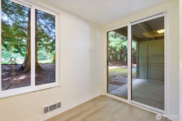 17514 151st Ave SE Unit 1-4, Renton, WA 98058 - doorway featuring light wood-style flooring and baseboards