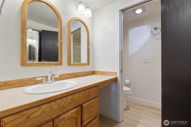 17514 151st Ave SE Unit 1-4, Renton, WA 98058 - bathroom featuring wood finished floors and vanity