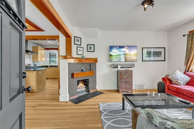 4222 Latona Ave NE, Seattle, WA 98105 - living room with light wood-type flooring and a fireplace