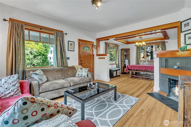 4222 Latona Ave NE, Seattle, WA 98105 - living area featuring healthy amount of natural light, wood finished floors, and a tiled fireplace