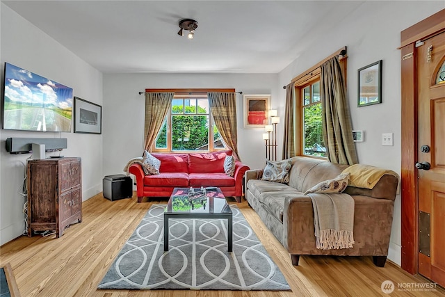 4222 Latona Ave NE, Seattle, WA 98105 - living room featuring healthy amount of natural light and wood finished floors
