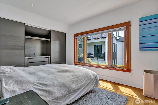 4222 Latona Ave NE, Seattle, WA 98105 - bedroom with wood finished floors and vaulted ceiling