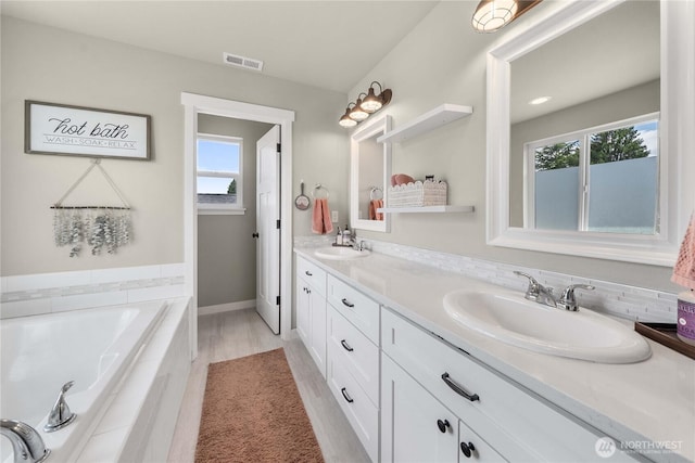3294 Prill Rd, Centralia, WA 98531 - bathroom featuring double vanity, plenty of natural light, and a garden tub