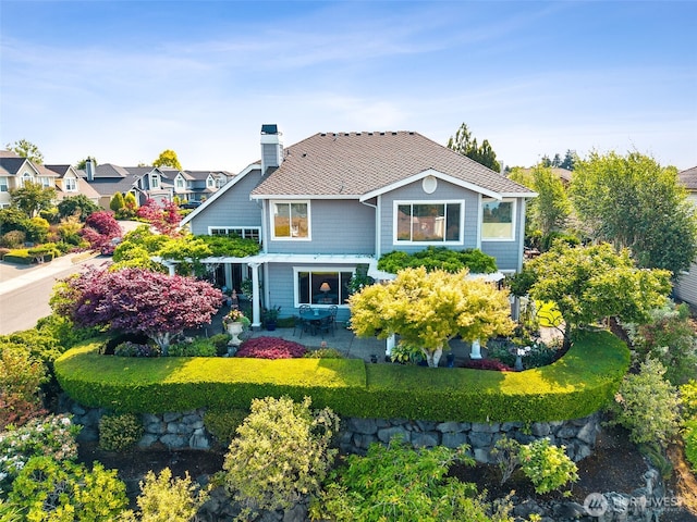 5422 21st Avenue Ct NE, Tacoma, WA 98422 - rear view of house featuring a chimney and a patio area