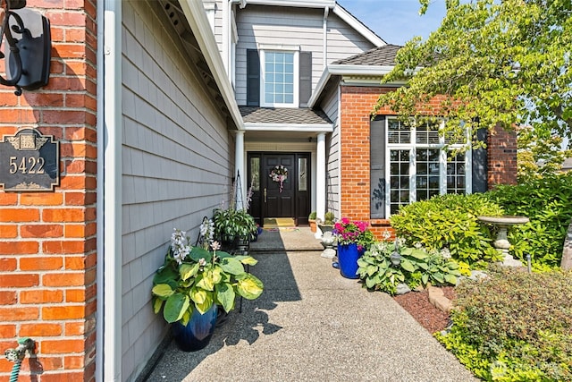 5422 21st Avenue Ct NE, Tacoma, WA 98422 - view of exterior entry with brick siding and roof with shingles