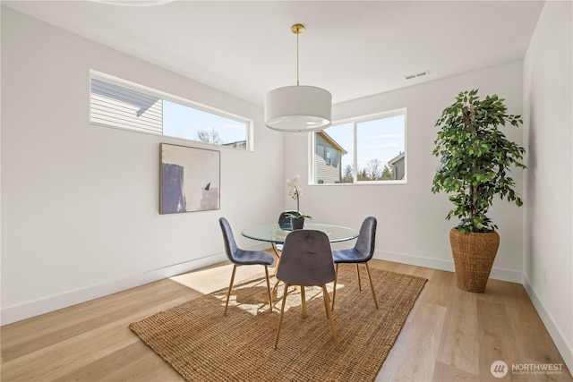 6732 21st Ave SW, Seattle, WA 98106 - dining room featuring healthy amount of natural light and light wood finished floors