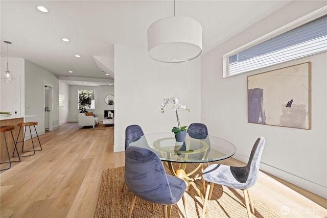 6732 21st Ave SW, Seattle, WA 98106 - dining area featuring light wood-style flooring and recessed lighting