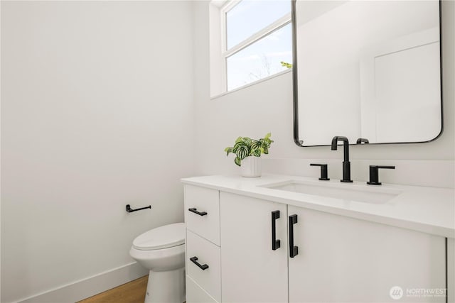 6732 21st Ave SW, Seattle, WA 98106 - half bath featuring vanity and wood finished floors
