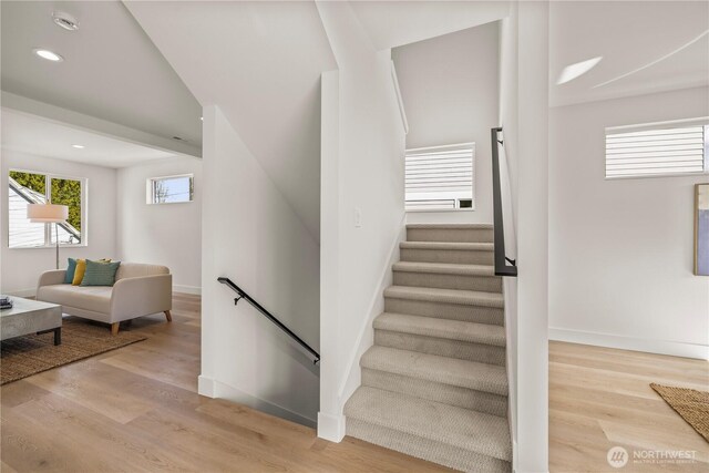 6732 21st Ave SW, Seattle, WA 98106 - staircase featuring wood finished floors and recessed lighting