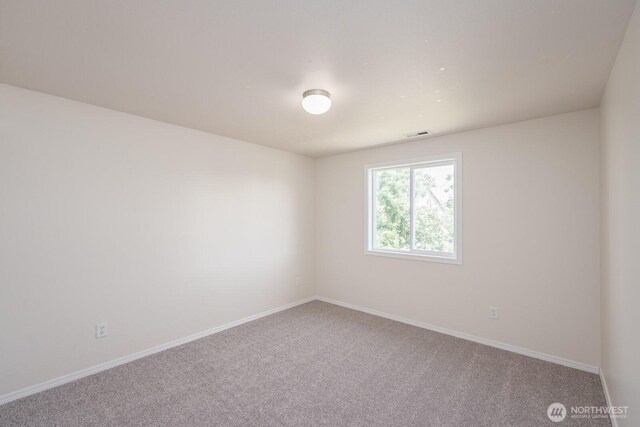 510 Trout Ave NE, Moses Lake, WA 98837 - empty room featuring carpet and baseboards