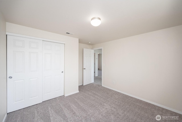 510 Trout Ave NE, Moses Lake, WA 98837 - unfurnished bedroom with carpet floors and a closet