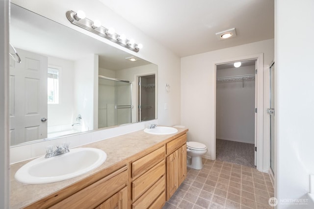 510 Trout Ave NE, Moses Lake, WA 98837 - bathroom with a walk in closet, a stall shower, double vanity, and a bath