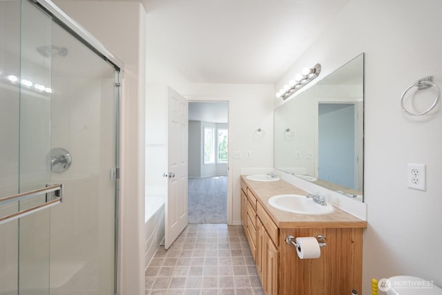 510 Trout Ave NE, Moses Lake, WA 98837 - bathroom featuring a shower stall, double vanity, and a garden tub