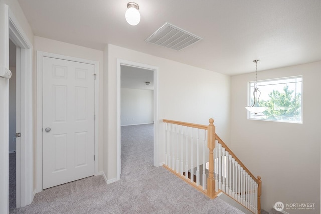 510 Trout Ave NE, Moses Lake, WA 98837 - hallway with an upstairs landing and carpet flooring