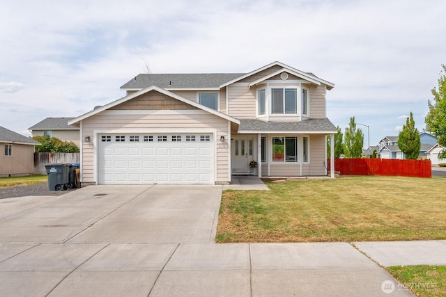 510 Trout Ave NE, Moses Lake, WA 98837 - traditional-style home with driveway, an attached garage, and a shingled roof