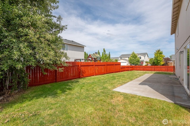 510 Trout Ave NE, Moses Lake, WA 98837 - fenced backyard with a patio area and a residential view