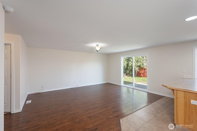 510 Trout Ave NE, Moses Lake, WA 98837 - unfurnished living room featuring wood finished floors and baseboards
