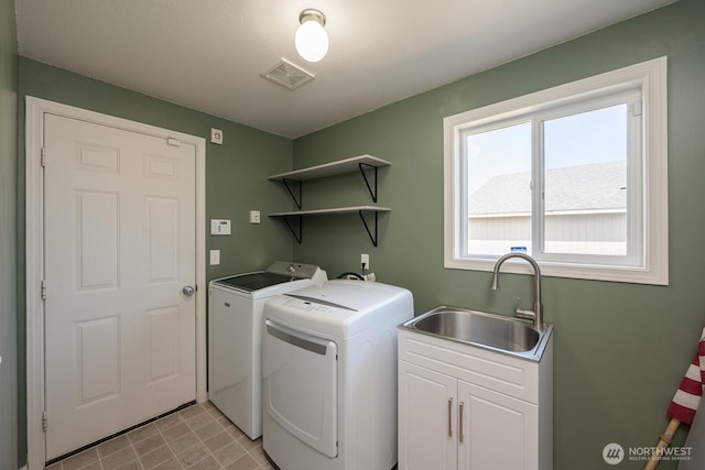 510 Trout Ave NE, Moses Lake, WA 98837 - laundry area with washer and dryer, cabinet space, and light floors
