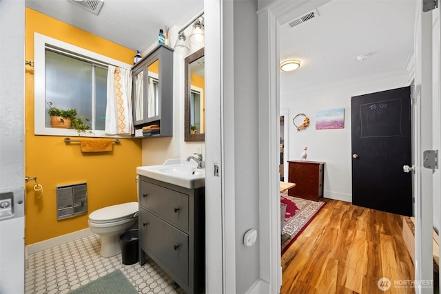 2413 Queen St, Bellingham, WA 98229 - bathroom with vanity, heating unit, and ornamental molding