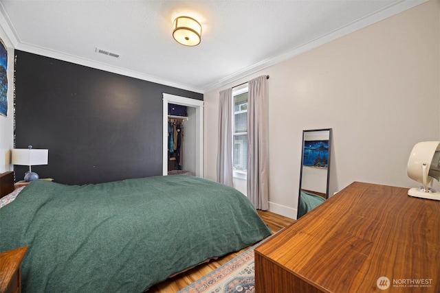 2413 Queen St, Bellingham, WA 98229 - bedroom with wood finished floors, crown molding, and a closet