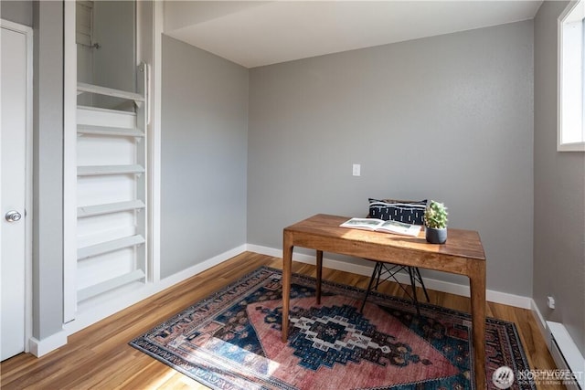 2413 Queen St, Bellingham, WA 98229 - office featuring wood finished floors and a baseboard heating unit