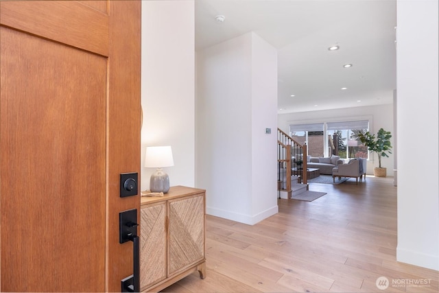 6209 32nd Ave NE, Seattle, WA 98115 - hall with light wood-type flooring, stairway, and recessed lighting