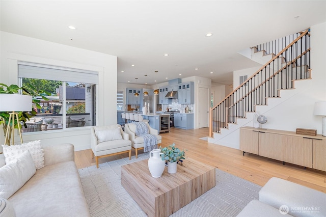 6209 32nd Ave NE, Seattle, WA 98115 - living room featuring stairs, light wood-type flooring, and recessed lighting