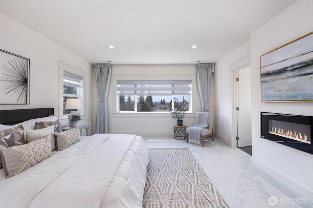 6209 32nd Ave NE, Seattle, WA 98115 - carpeted bedroom featuring a glass covered fireplace and recessed lighting