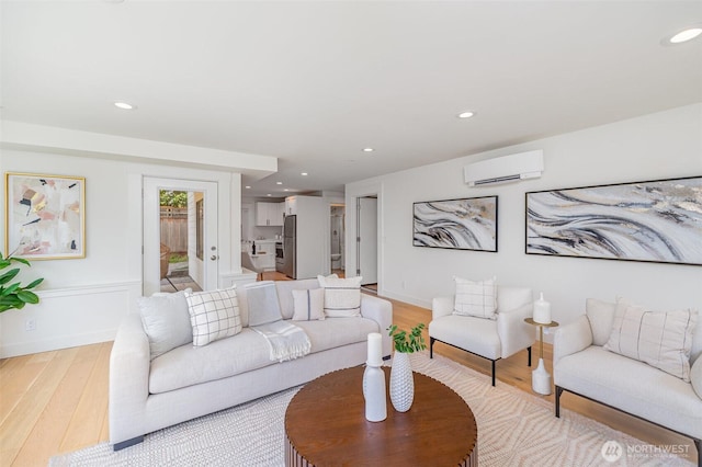 6209 32nd Ave NE, Seattle, WA 98115 - living area featuring a wall unit AC, light wood-style floors, and recessed lighting