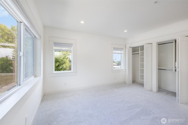 6209 32nd Ave NE, Seattle, WA 98115 - unfurnished bedroom featuring multiple closets, carpet, and recessed lighting