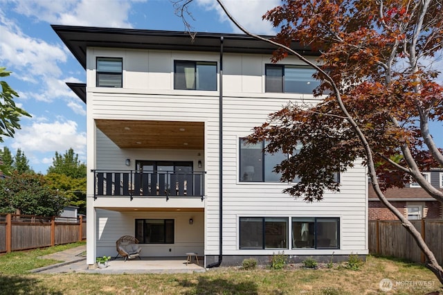 6209 32nd Ave NE, Seattle, WA 98115 - rear view of property featuring a balcony, a patio area, and a fenced backyard