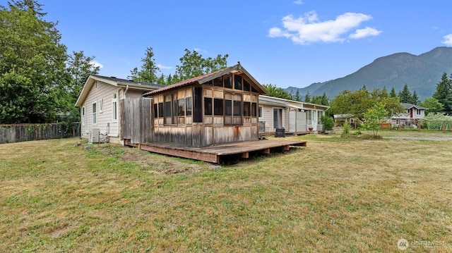 41427 Mountain View Pl E, Gold Bar, WA 98251 - back of house with a sunroom and a deck with mountain view