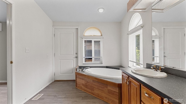 41427 Mountain View Pl E, Gold Bar, WA 98251 - full bathroom featuring vanity, a bath, and wood finished floors