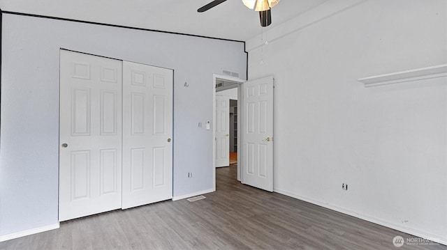 41427 Mountain View Pl E, Gold Bar, WA 98251 - unfurnished bedroom featuring wood finished floors, a closet, and a ceiling fan