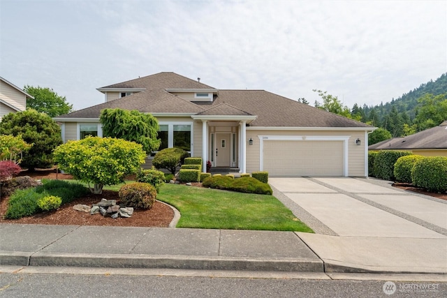 2108 S 18th St, Mount Vernon, WA 98274 - view of front of property with a garage, concrete driveway, and a front lawn