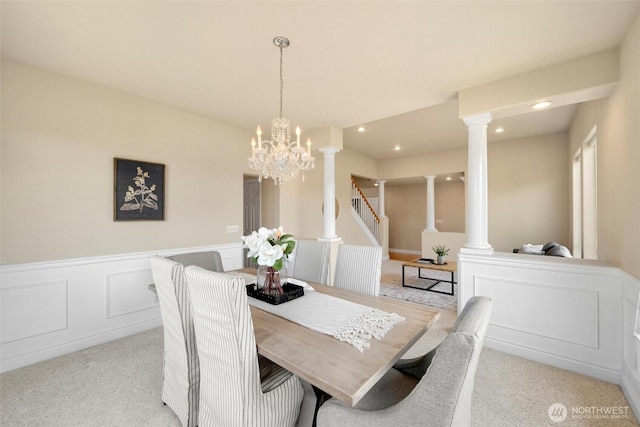 2108 S 18th St, Mount Vernon, WA 98274 - dining area featuring light carpet, a chandelier, a wainscoted wall, ornate columns, and recessed lighting