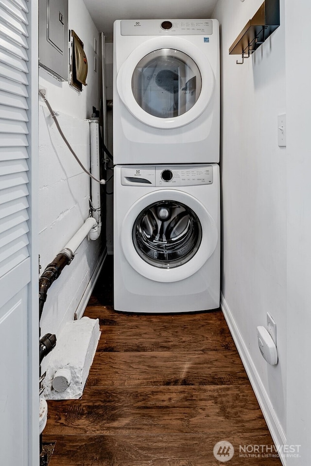 2711 NW 80th St, Seattle, WA 98117 - laundry room featuring stacked washing machine and dryer, electric panel, and wood finished floors