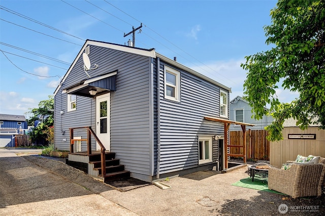2711 NW 80th St, Seattle, WA 98117 - back of property featuring a fire pit