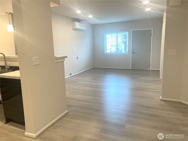 921 Westridge Way NE # 102, Issaquah, WA 98029 - empty room featuring light wood-style floors, recessed lighting, and a wall mounted air conditioner