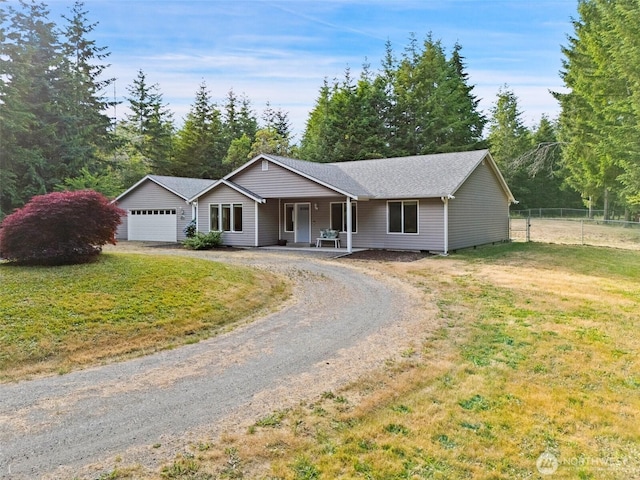 2733 Teal Lake Rd, Port Ludlow, WA 98365 - ranch-style home featuring dirt driveway, an attached garage, and a porch