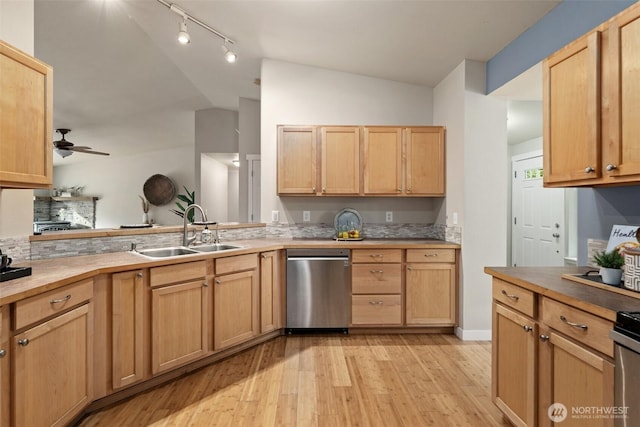 2733 Teal Lake Rd, Port Ludlow, WA 98365 - kitchen with stainless steel dishwasher, vaulted ceiling, ceiling fan, light wood-style flooring, and rail lighting