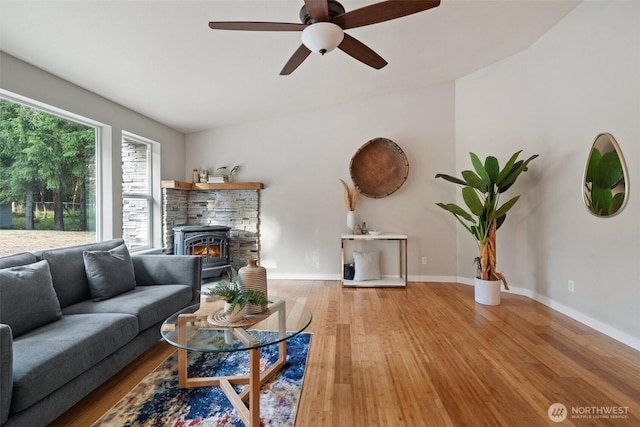 2733 Teal Lake Rd, Port Ludlow, WA 98365 - living area featuring wood finished floors, ceiling fan, and a fireplace