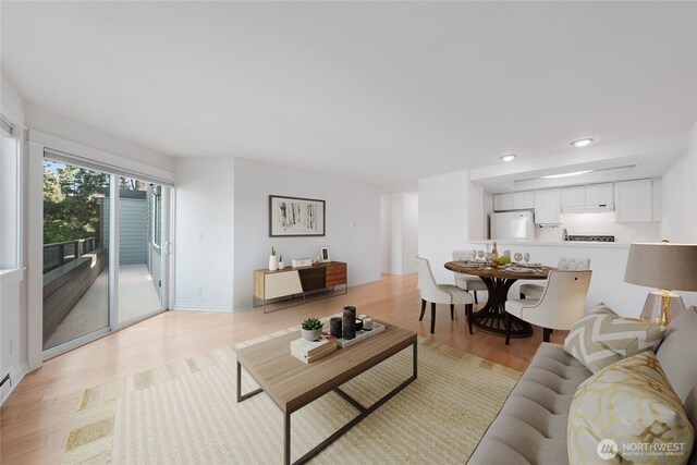 6055 35th Ave SW Unit 308, Seattle, WA 98126 - living room featuring light wood-type flooring and recessed lighting