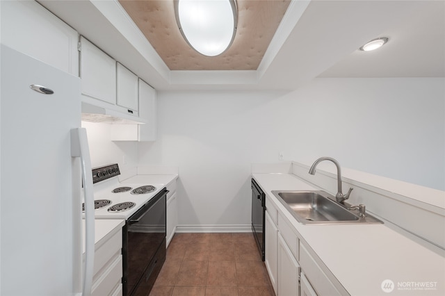 6055 35th Ave SW Unit 308, Seattle, WA 98126 - kitchen with freestanding refrigerator, range with electric cooktop, under cabinet range hood, a raised ceiling, and white cabinets