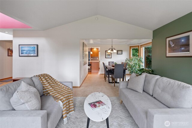 5207 170th St E, Tacoma, WA 98446 - living area featuring a chandelier, vaulted ceiling, and light carpet
