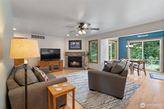 5207 170th St E, Tacoma, WA 98446 - living room featuring plenty of natural light, light wood-style floors, ceiling fan, and recessed lighting