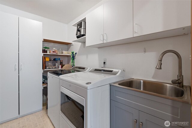 5207 170th St E, Tacoma, WA 98446 - laundry room featuring washer and dryer and cabinet space